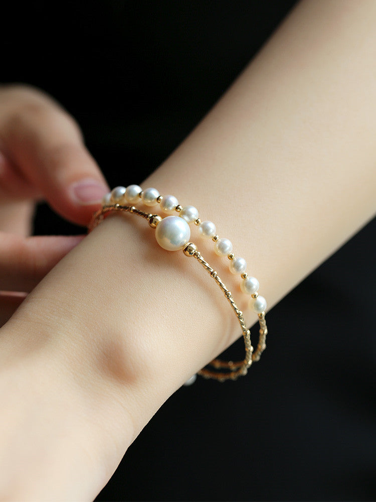 Pulsera elástica multicapa de perlas de agua dulce ligeras y resistentes para mujer