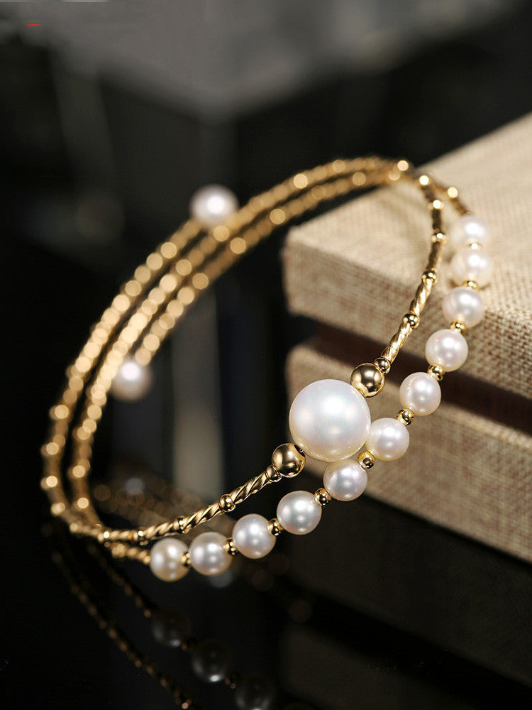 Pulsera elástica multicapa de perlas de agua dulce ligeras y resistentes para mujer