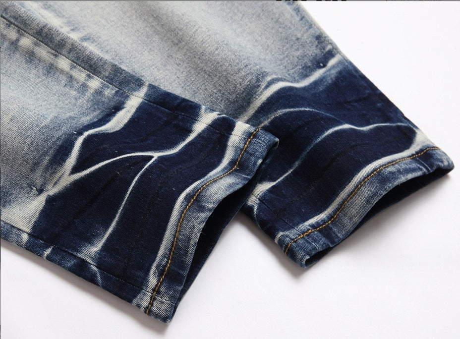 Jean usé de couleur claire pour homme avec patchs endommagés